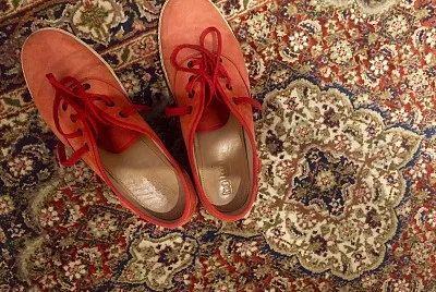Red shoes on Kashmiri rug
