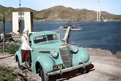 1935 Oldsmobile coupe and Golden Gate Bridge under