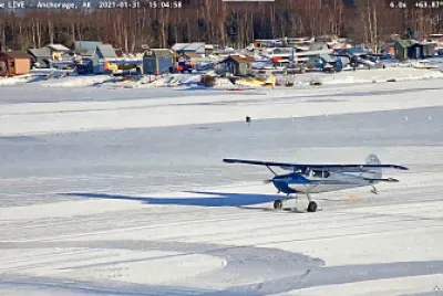 Ski landing on lake-2 blue plane jigsaw puzzle