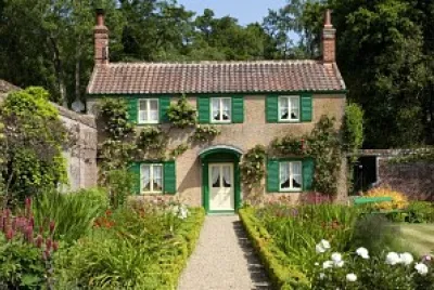 English cottage with green shutters