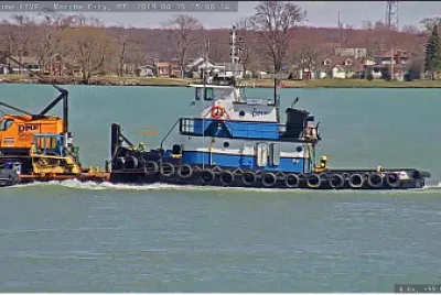 tug  "Kimberly Anne " and a crane barge