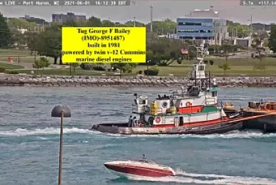 tug George f Bailey pushing a  "scow " barge on St C