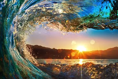 Sunrise through wave