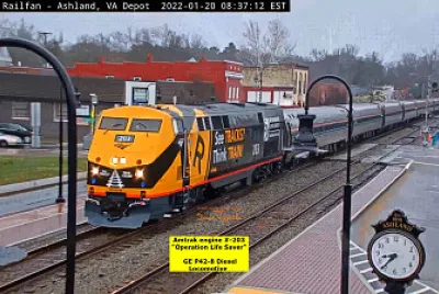 Amtrak engine #-203  "Operation Life Saver ", in the rain on Main st.