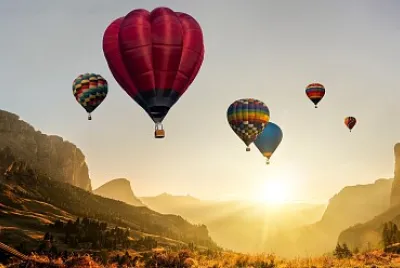 Hot Air Balloons over Canyon at Sunrise