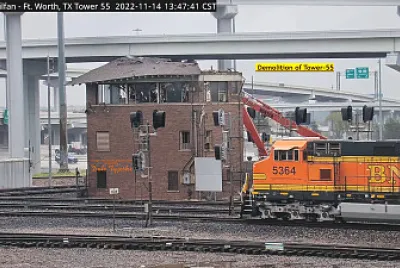 BNSF-5364 passing    "Tower-55 " being demolished