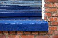 Brick wall and a Blue window