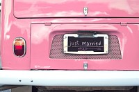 just married sign on pink classic vintage van