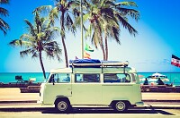 Classic caravan parked in front of the beach