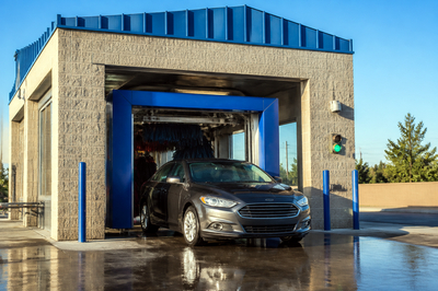 Car Exiting Wash Tunnel(grok)