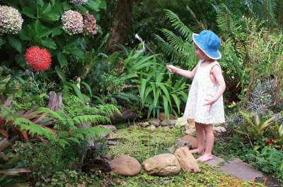 Little girl and fish pond, South Africa