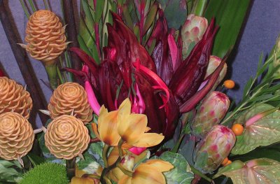 Orange and burgundy flower arrangement