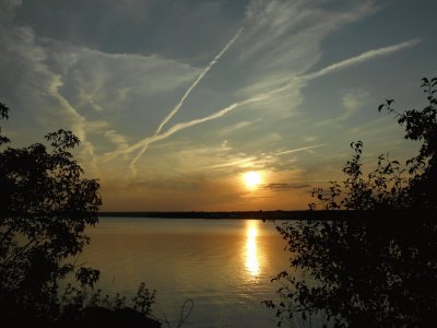 Criss-crossing contrails at sunset   L