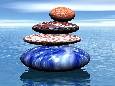 Stack of balanced stones on the sea.