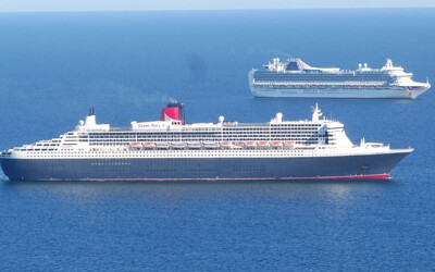 Queen Mary 2 anchored in Weymouth Bay with P O Cru
