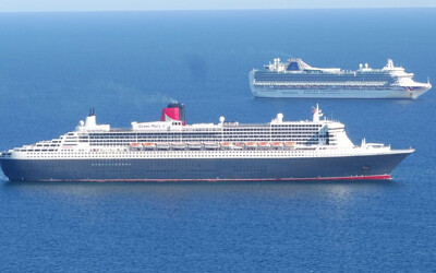 Queen Mary 2 anchored in Weymouth Bay with P O Cru