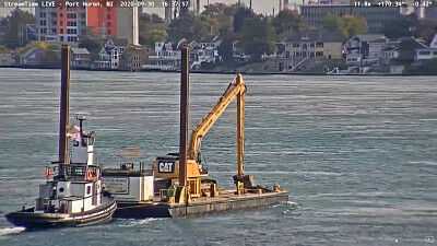 פאזל של tug Capt Keith pushing a Spud-Barge with excavator