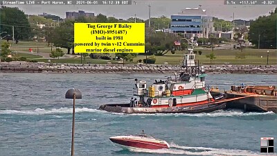 tug George f Bailey pushing a  "scow " barge on St C