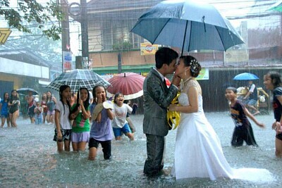 Newlyweds in rain