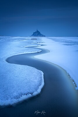 פאזל של Mont St Michel enneigé