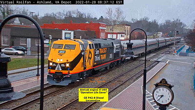 Amtrak engine #-203  "Operation Life Saver ", in the rain on Main st.