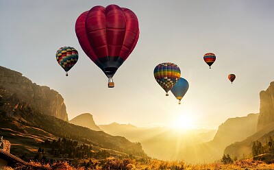 Hot Air Balloons over Canyon at Sunrise