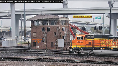 BNSF-5364 passing    "Tower-55 " being demolished