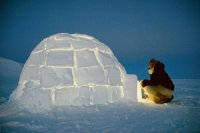 Inuit hunter about to enter his Igloo Greenland